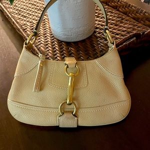 Coach pebbled leather purse in beige